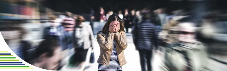 Woman hiding face in crowd