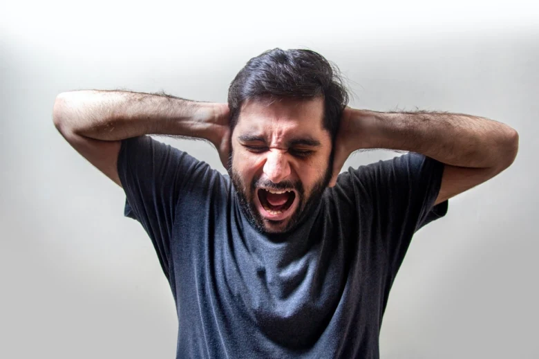 Man holding head in pain
