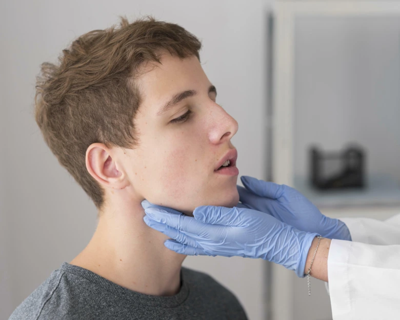 Doctor examining patient neck