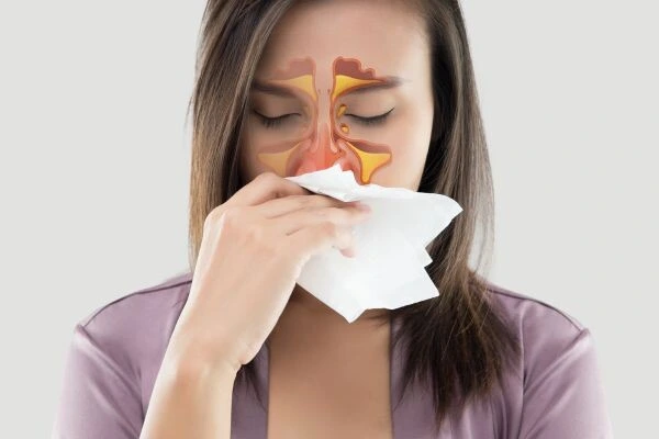 Woman blowing nose with sinus overlay