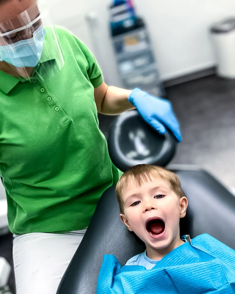 Child in dental chair with dentist