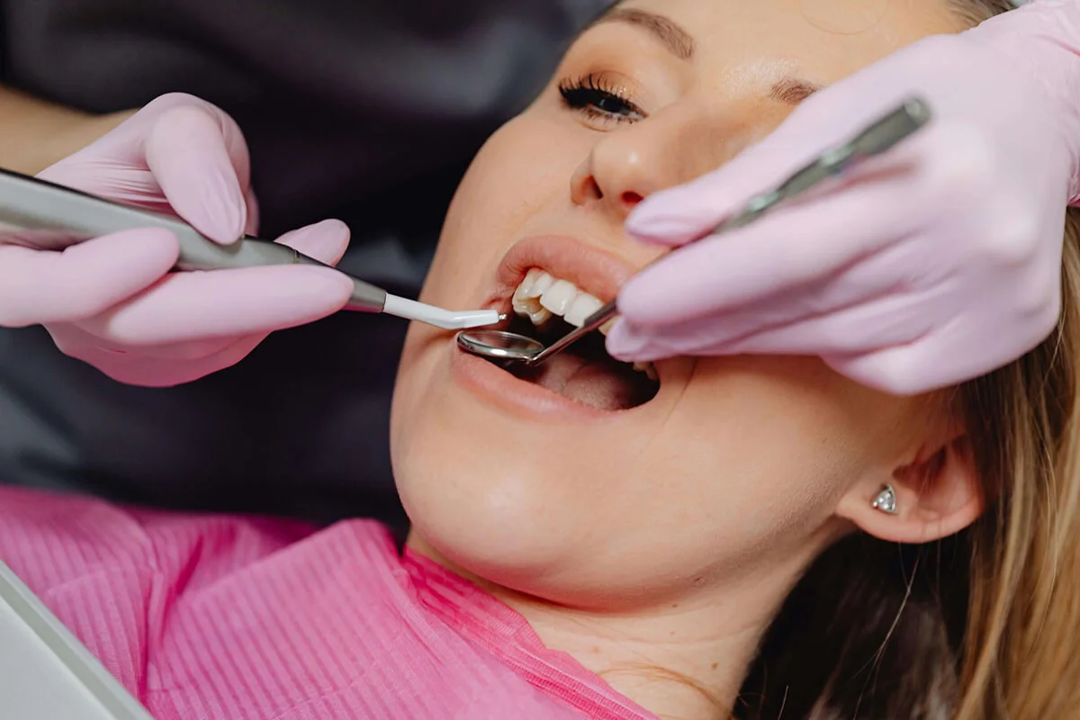 Woman receiving dental exam