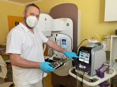 Medical professional with mammography equipment