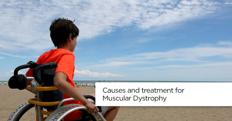 Boy in wheelchair on beach