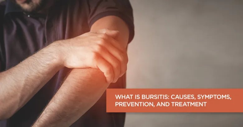 Man holding elbow in pain