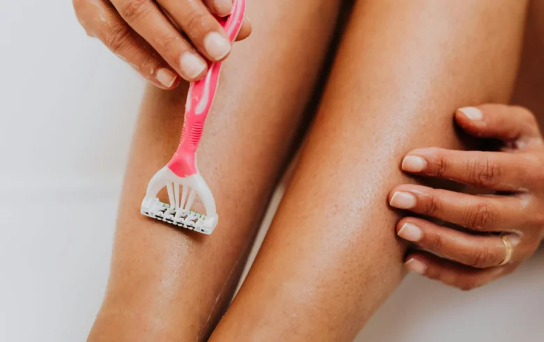 Shaving legs with razor