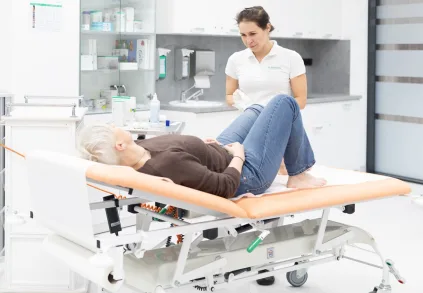 Nurse and patient on medical bed